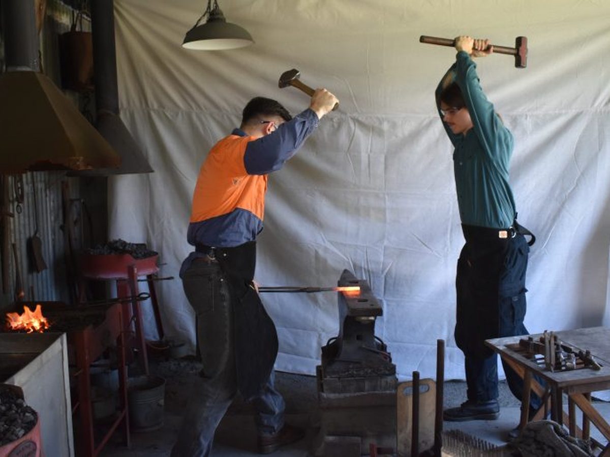 Strikers at the anvil during a class